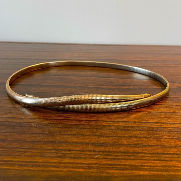 Vintage Accessories - Vintage 1970s crossover metal belt, approx 31”, unique clasp and look